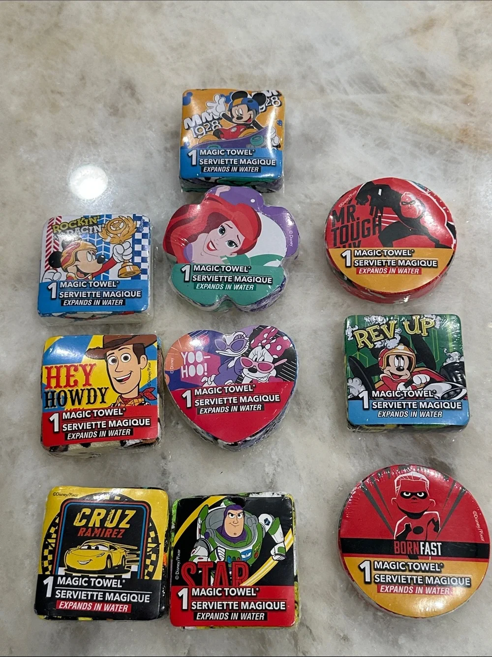 Disney Assorted Character Magic Towels – Red, Blue, Green, Orange Set of 10